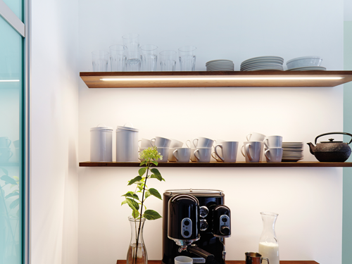 Back lit shelving using built in LED lighting for modern effect.