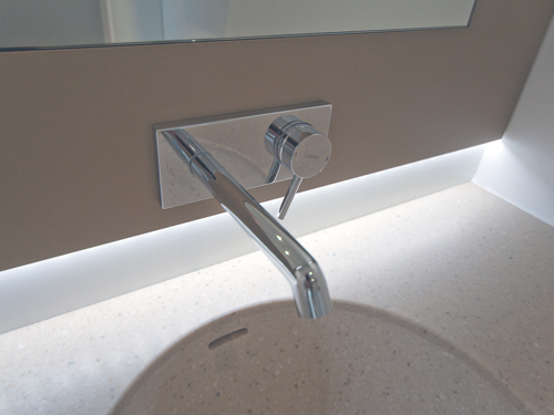 LED light positioned under tapware. Wall mounted tapware and vanity.